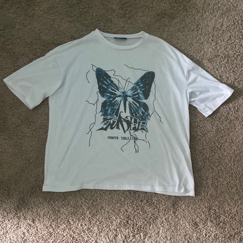 Never worn shein short sleeved t-shirt with a butterfly on the front